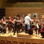 Peter Cigleris playing the clarinet with an orchestra