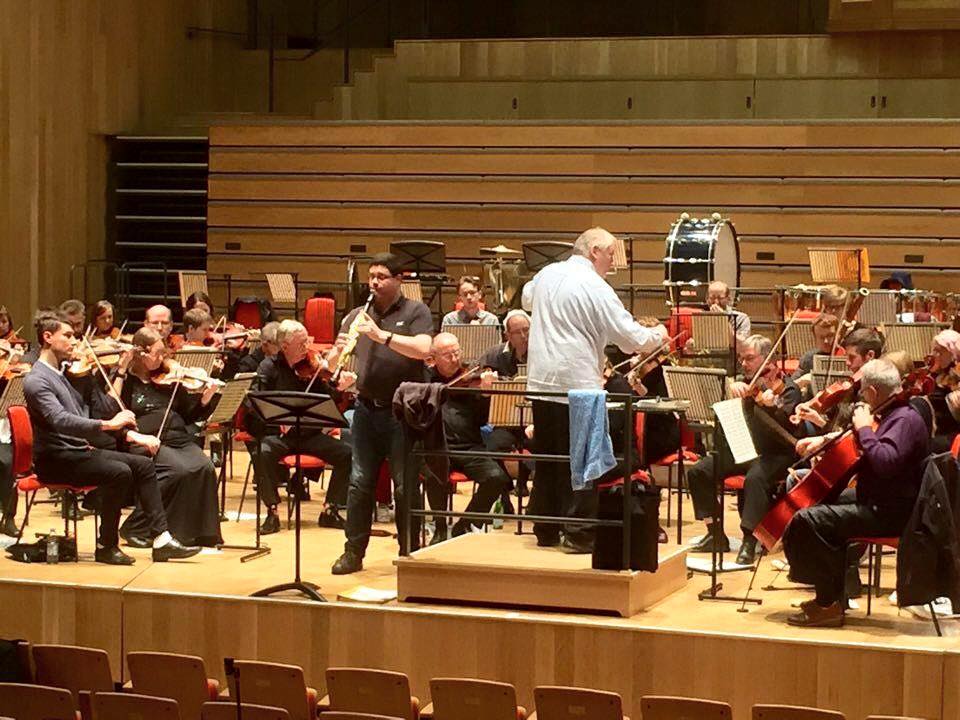 Peter Cigleris playing the clarinet with an orchestra